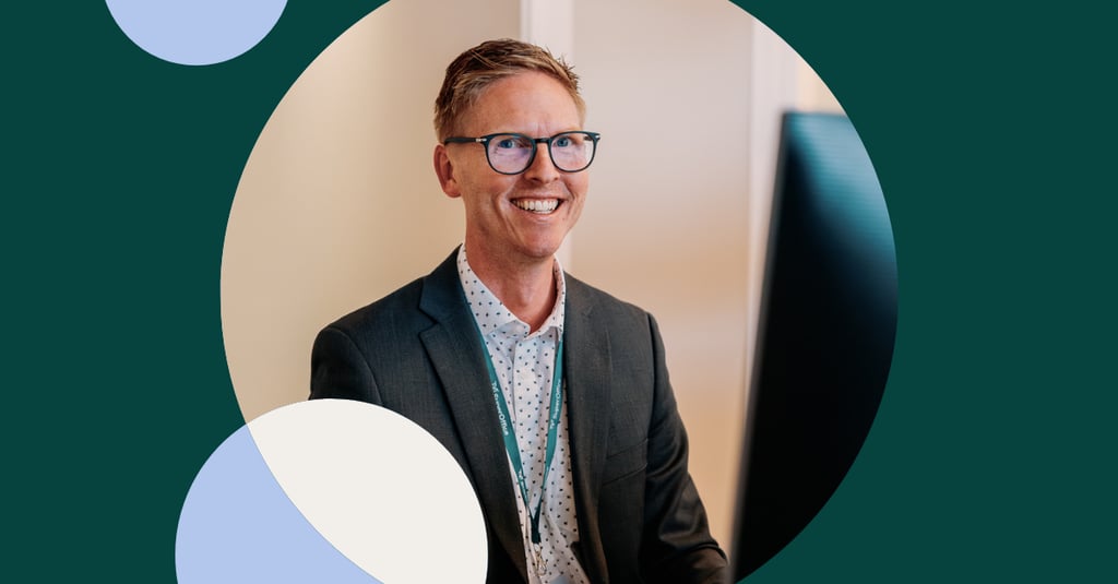 Photo of man in front of computer