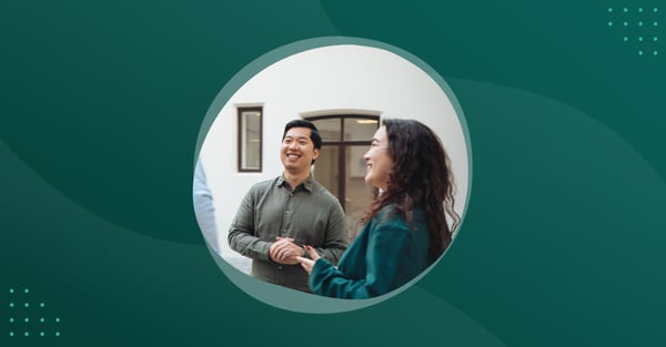 Photo of two people talking outside a office