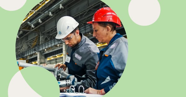 Picture of two people working in a factory