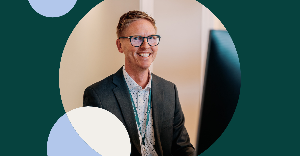 Photo of man in front of computer