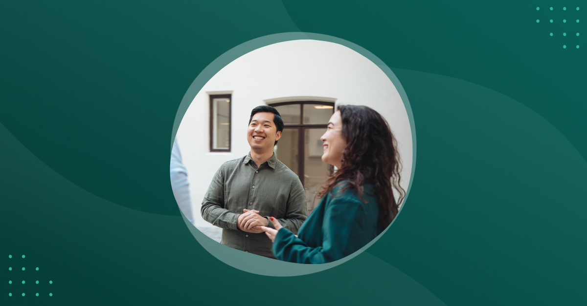 Photo of two people talking outside a office