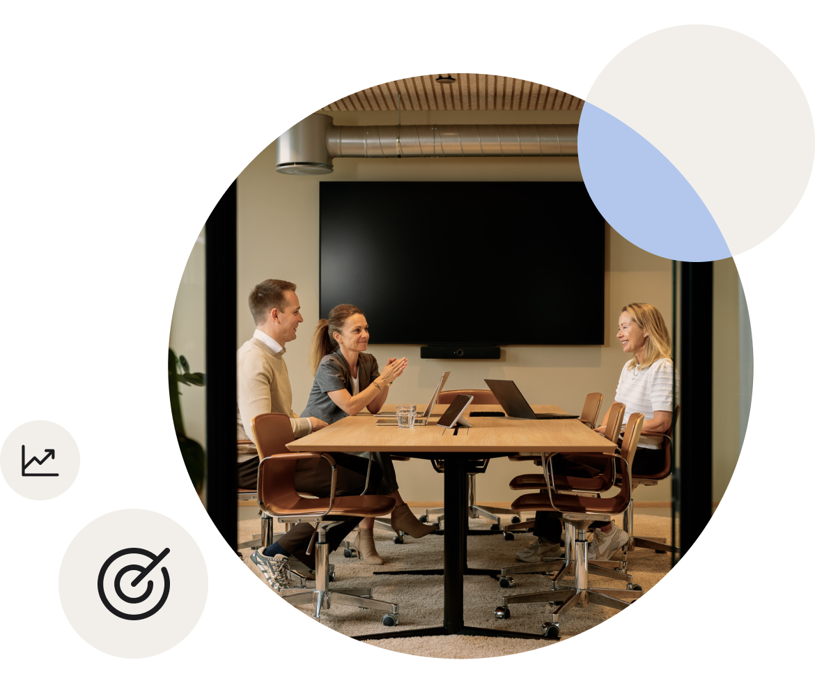 Team collaborating around a table in a meeting room